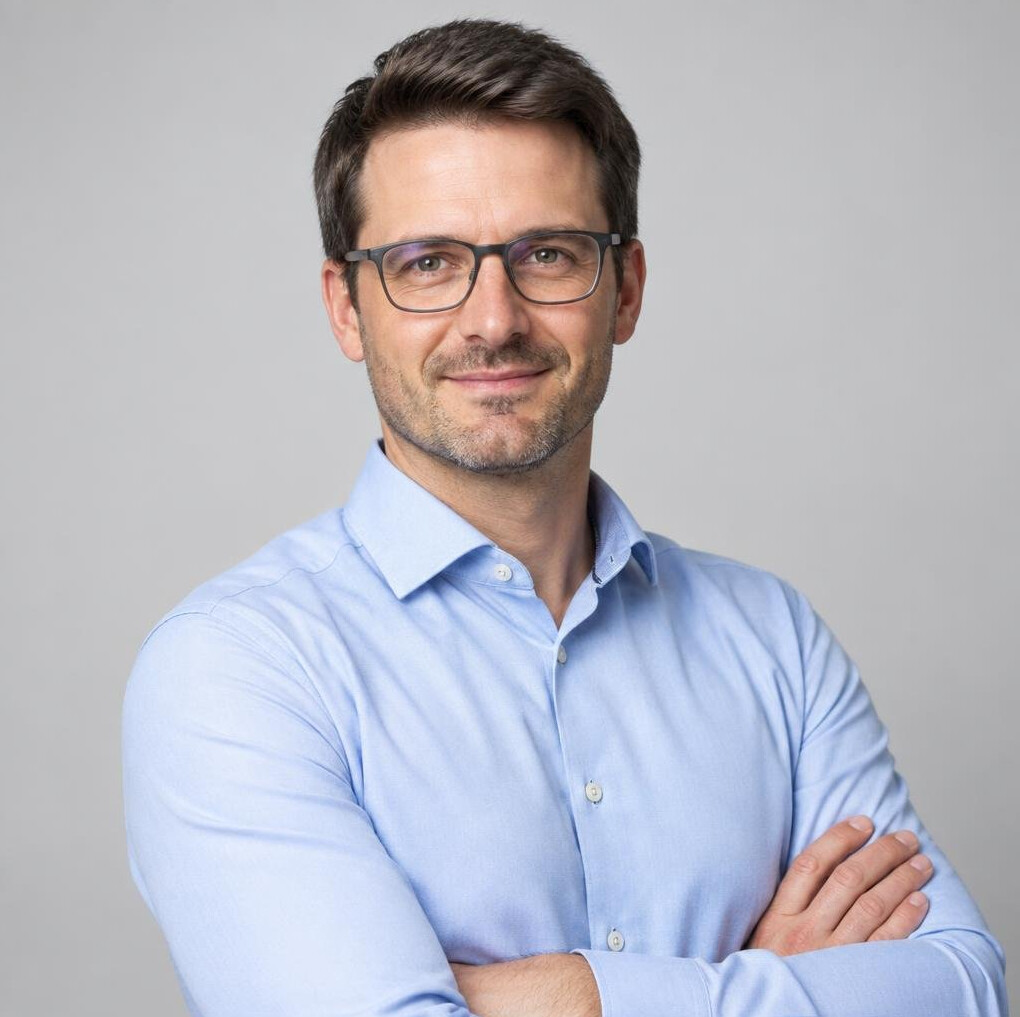 Studio portrait of a German man in his late thirties in business casual attire