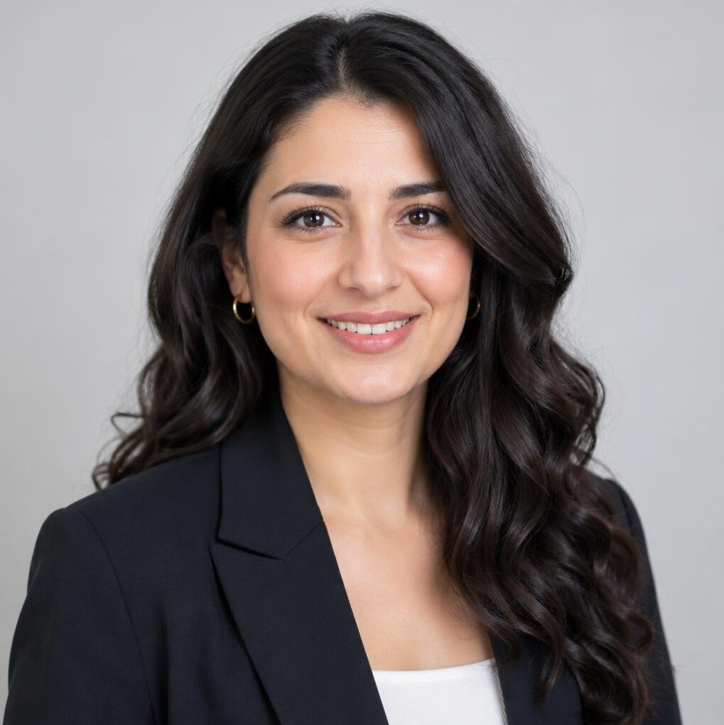 Studio portrait of a Turkish-German woman in her early thirties in a blazer