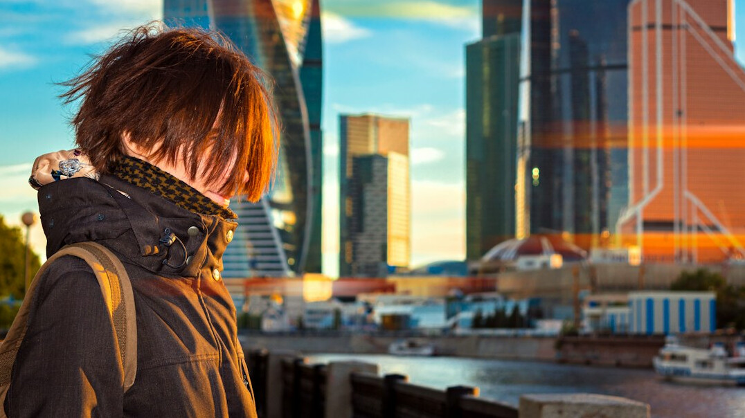 person looking worried in city